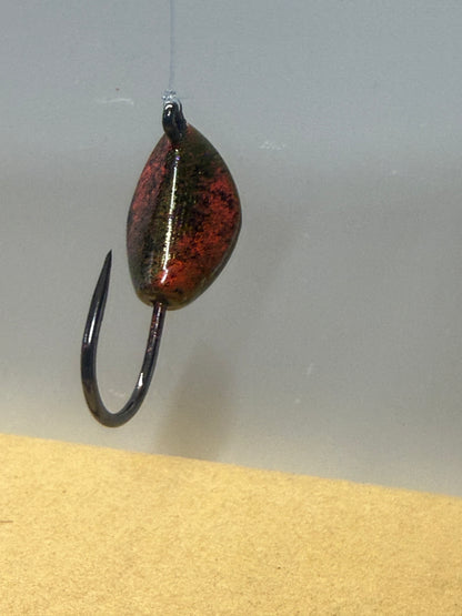Greenish base with accents of black and orange.