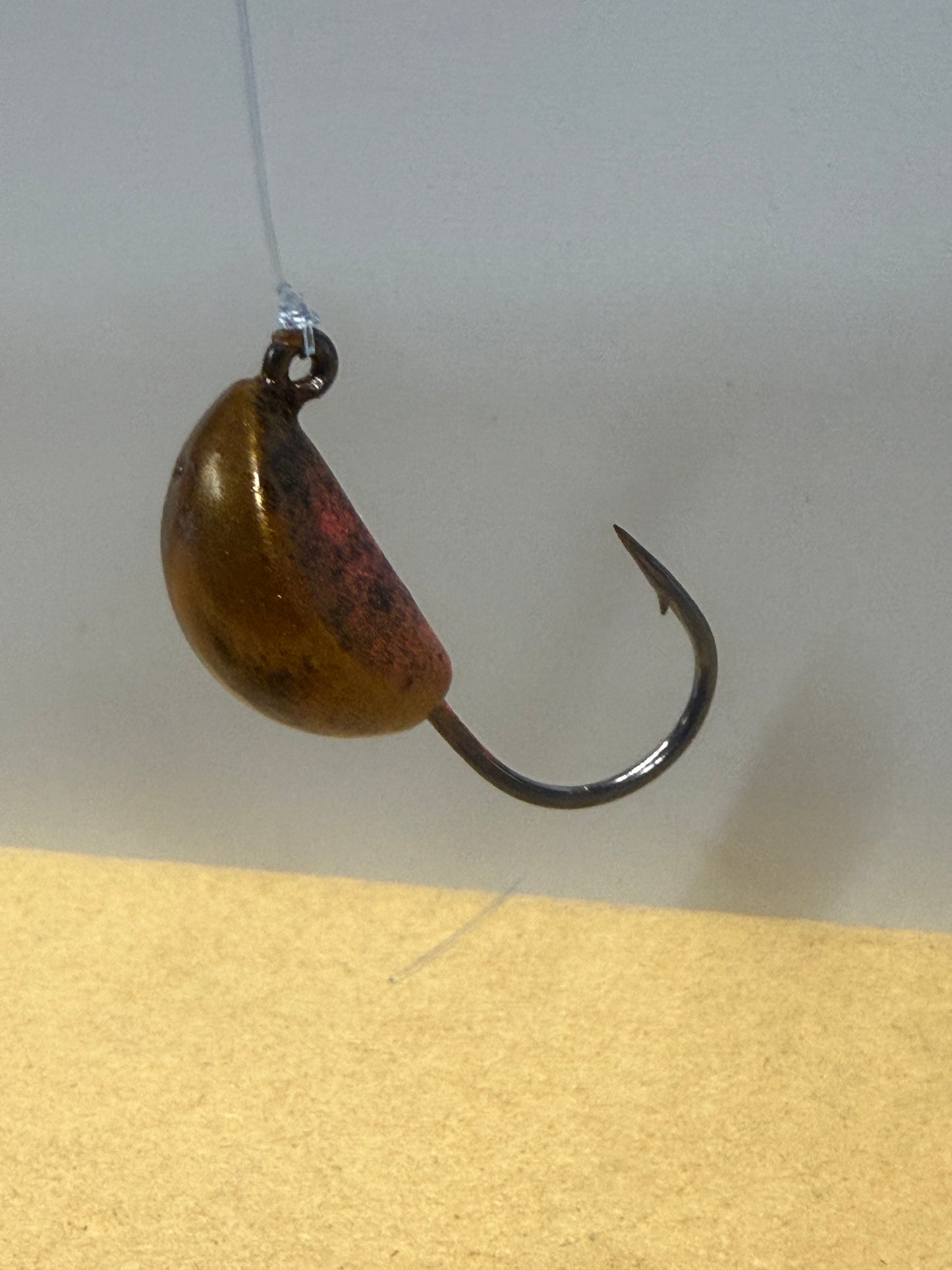 Sandy base with orange and black accents.